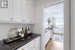 Service Area Between the Dining Room & the Kitchen - 