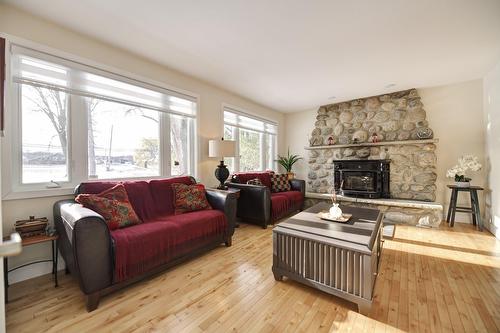 Salon - 5375 Boul. Des Mille-Îles, Laval (Saint-François), QC - Indoor Photo Showing Living Room With Fireplace
