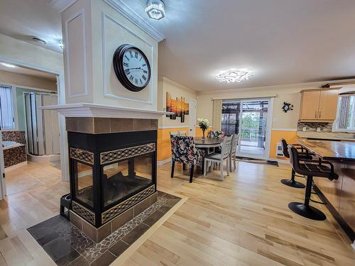 Family room - 312 Rue Mary, Lachute, QC - Indoor Photo Showing Dining Room With Fireplace