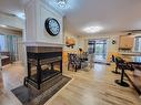 Family room - 312 Rue Mary, Lachute, QC  - Indoor Photo Showing Dining Room With Fireplace 