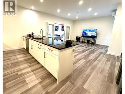 Main suite with high end flooring and counters. - 