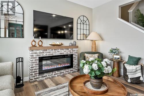 212 Froese Crescent, Warman, SK - Indoor Photo Showing Living Room With Fireplace