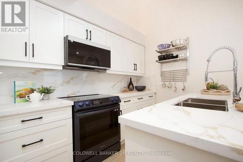 27 - C-12 1655 Nash Road, Clarington (Courtice), ON - Indoor Photo Showing Kitchen With Double Sink
