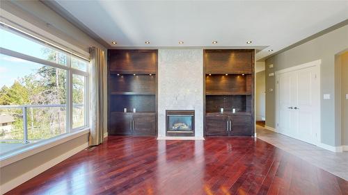 1631 Mt. Pyramid Crescent, Cranbrook, BC - Indoor Photo Showing Other Room With Fireplace