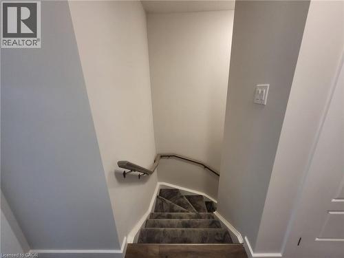 Stairway featuring baseboards - 118 Gravel Ridge Trail Unit# A8, Kitchener, ON - Indoor Photo Showing Other Room