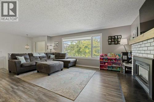 1777 Autumn Road, Kelowna, BC - Indoor Photo Showing Living Room With Fireplace