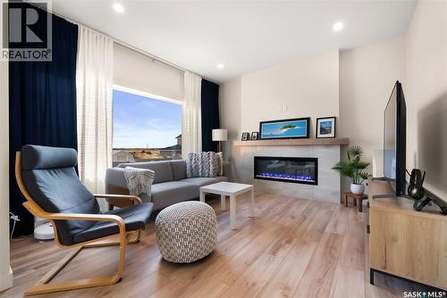 40 Mackenzie Crescent, Pilot Butte, SK - Indoor Photo Showing Living Room With Fireplace