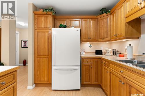 211 2885 Arens Road E, Regina, SK - Indoor Photo Showing Kitchen With Double Sink