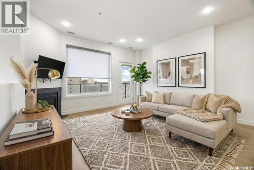 607 2055 Rose Street, Regina, SK - Indoor Photo Showing Living Room With Fireplace