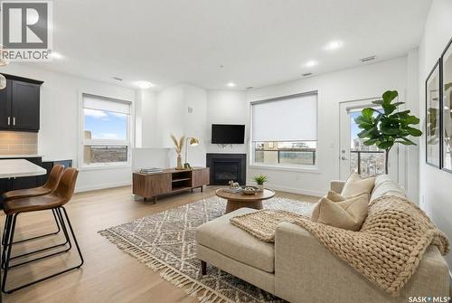 607 2055 Rose Street, Regina, SK - Indoor Photo Showing Living Room With Fireplace