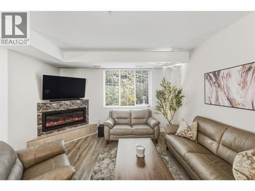 living room - 921 Spillway Road Unit# 102B, Oliver, BC - Indoor Photo Showing Living Room With Fireplace