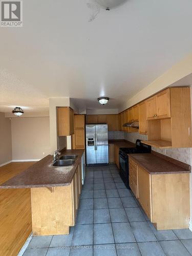 10 Wuthering Heights Road, Toronto, ON - Indoor Photo Showing Kitchen With Double Sink