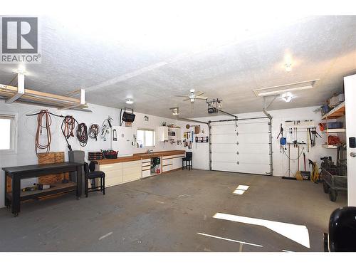garage is 22.10 wide x 28.11 deep - 75 Antoine Road Unit# 103, Vernon, BC - Indoor Photo Showing Garage