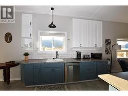 window over the sink with a great lakeview - 