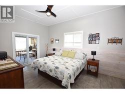 Primary bedroom with doors out to the covered back deck - 