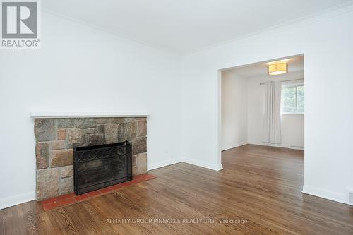 22 Sunset Court, Kawartha Lakes (Lindsay), ON - Indoor Photo Showing Living Room With Fireplace