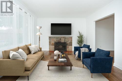 22 Sunset Court, Kawartha Lakes (Lindsay), ON - Indoor Photo Showing Living Room With Fireplace