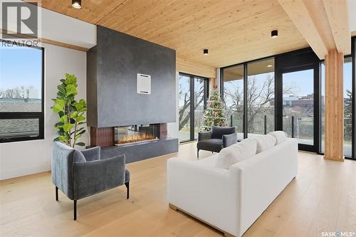 301 212 E Saskatchewan Crescent E, Saskatoon, SK - Indoor Photo Showing Living Room With Fireplace