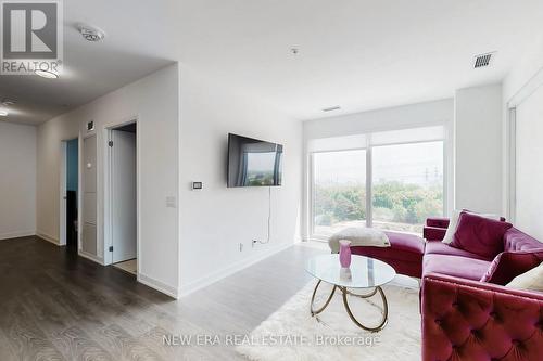 413 - 30 Samuel Wood Way, Toronto, ON - Indoor Photo Showing Living Room