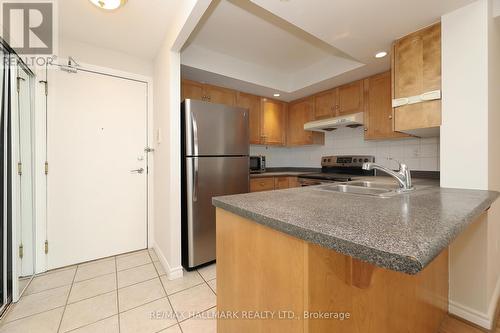 granite counters and breakfast bar - 929 - 125 Omni Drive, Toronto, ON - Indoor Photo Showing Kitchen With Double Sink