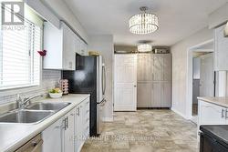 Kitchen with stainless steel appliances; pantry - 