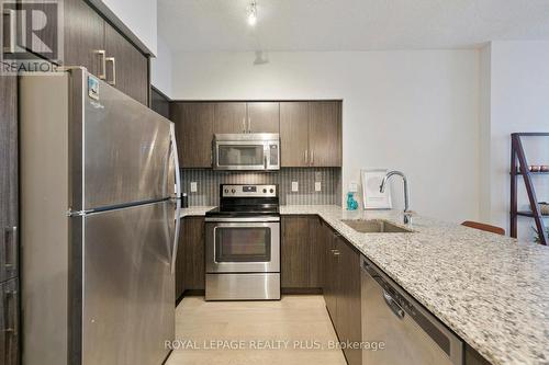 406 - 65 Speers Road, Oakville, ON - Indoor Photo Showing Kitchen With Stainless Steel Kitchen With Upgraded Kitchen