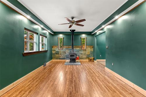 6927 Customs Road, Kingsgate, BC - Indoor Photo Showing Other Room With Fireplace