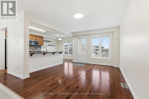 Living room leading to large balcony - 1875 Maple Grove Road, Ottawa, ON - Indoor