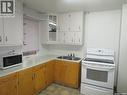 206 3Rd Avenue E, Assiniboia, SK  - Indoor Photo Showing Kitchen With Double Sink 