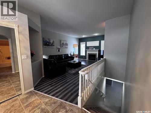 611 Le May Court, Saskatoon, SK - Indoor Photo Showing Other Room With Fireplace