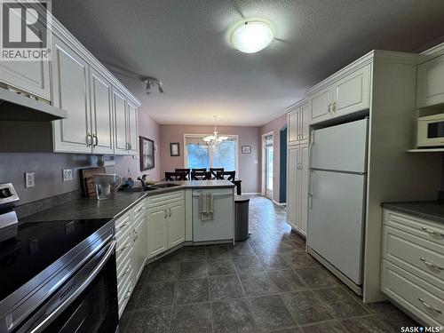 611 Le May Court, Saskatoon, SK - Indoor Photo Showing Kitchen With Double Sink