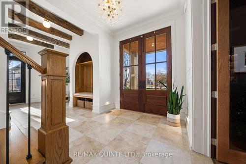 Foyer with wood front doors and built in - 88 Bridge Street, Prince Edward County (Picton Ward), ON - Indoor Photo Showing Other Room