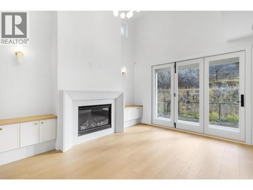 1012 Bull Crescent, Kelowna, BC - Indoor Photo Showing Living Room With Fireplace