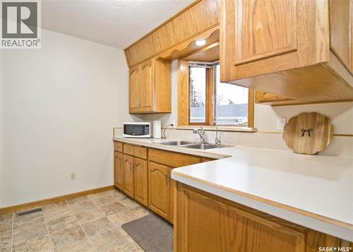 409 Garnet Street N, Regina, SK - Indoor Photo Showing Kitchen With Double Sink