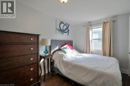 Bedroom with dark wood-style flooring - 131 Elmwood Avenue, Cambridge, ON - Indoor Photo Showing Bedroom