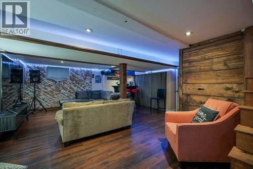 Living area featuring wood finished floors, recessed lighting, and wood walls - 131 Elmwood Avenue, Cambridge, ON - Indoor
