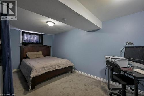 Bedroom featuring light colored carpet and an office area - 131 Elmwood Avenue, Cambridge, ON - Indoor Photo Showing Bedroom