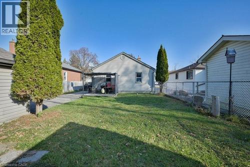 Fenced backyard with a patio area - 131 Elmwood Avenue, Cambridge, ON - Outdoor