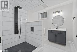 Bathroom with vanity and a tile shower - 