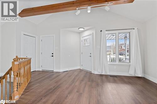 Entryway featuring dark wood-style flooring and track lighting - 16 Bush Street, Collingwood, ON - Indoor Photo Showing Other Room