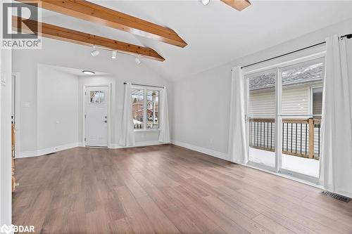 Unfurnished living room featuring light wood-type flooring and baseboards - 16 Bush Street, Collingwood, ON - Indoor Photo Showing Other Room
