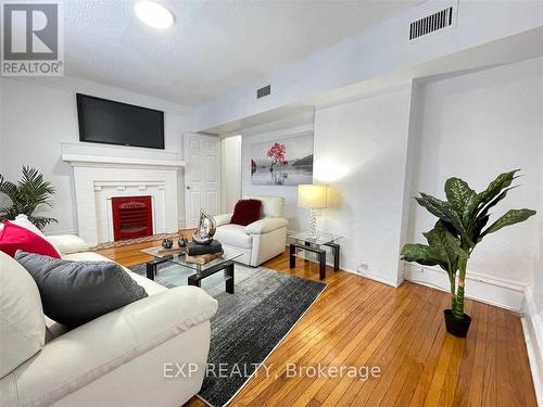 Upper - 229 Locke Street S, Hamilton, ON - Indoor Photo Showing Living Room With Fireplace