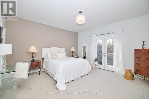 Walk-out to back deck from primary bedroom - 394 Hummel Crescent, Fort Erie (Lakeshore), ON - Indoor Photo Showing Bedroom