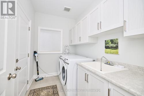 Laundry room with access to garage  & ceramic sink - 394 Hummel Crescent, Fort Erie (Lakeshore), ON - Indoor Photo Showing Laundry Room