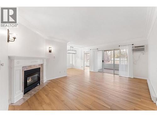 1055 Lawrence Avenue Unit# 210, Kelowna, BC - Indoor Photo Showing Living Room With Fireplace
