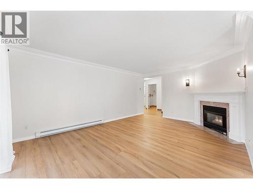 1055 Lawrence Avenue Unit# 210, Kelowna, BC - Indoor Photo Showing Living Room With Fireplace