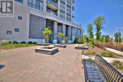 landscaping with bench - 1001 - 7711 Green Vista Gate, Niagara Falls (Oldfield), ON - Outdoor With Balcony