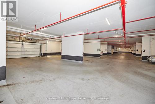 2 spot underground parking with auto-door - 1001 - 7711 Green Vista Gate, Niagara Falls (Oldfield), ON - Indoor Photo Showing Garage