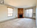 305 1110 9Th Avenue Ne, Swift Current, SK  - Indoor Photo Showing Other Room With Fireplace 
