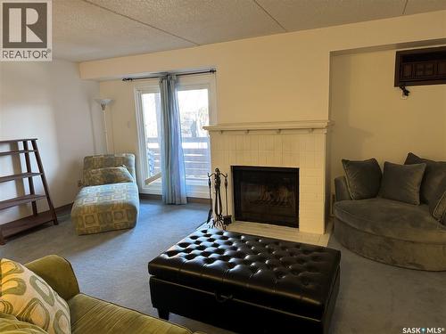 204 463 Pendygrasse Road, Saskatoon, SK - Indoor Photo Showing Living Room With Fireplace